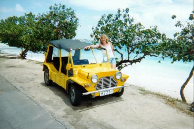 Kim hiding behind a moke